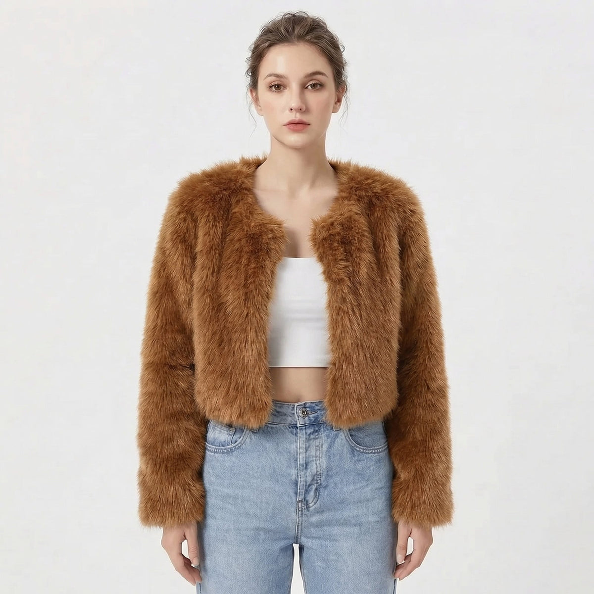 Front view of a model wearing a brown cropped faux fur jacket.