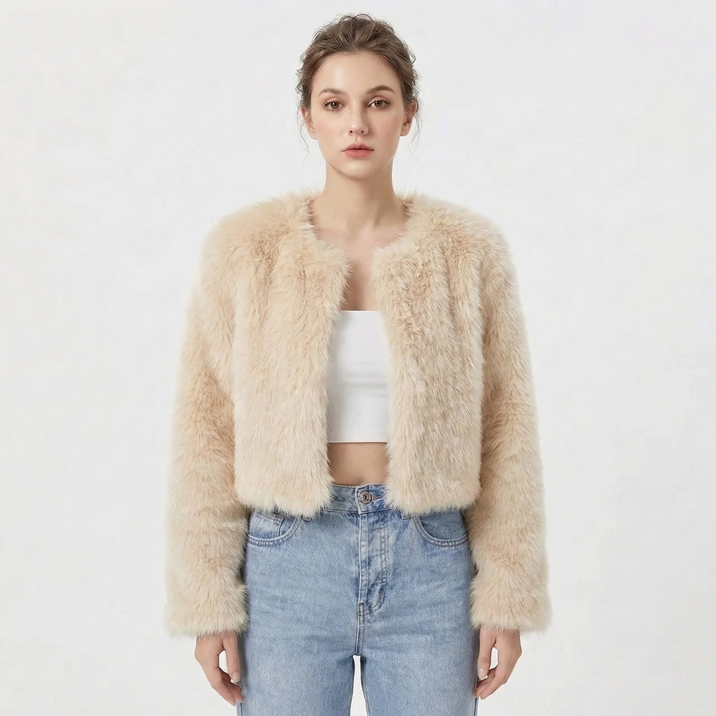 Front view of a model wearing a light beige cropped faux fur jacket.