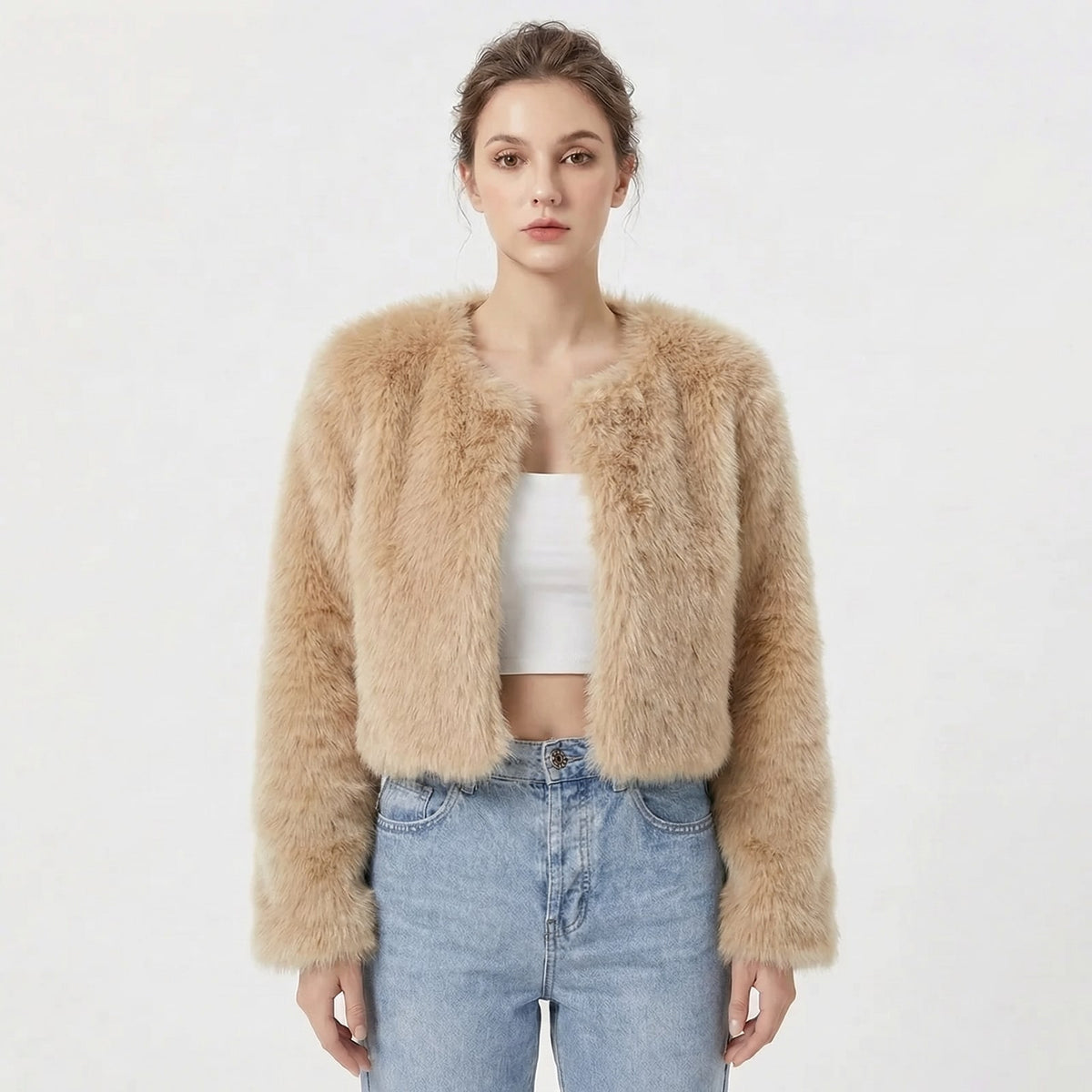 Front view of a model wearing a tan cropped faux fur jacket.