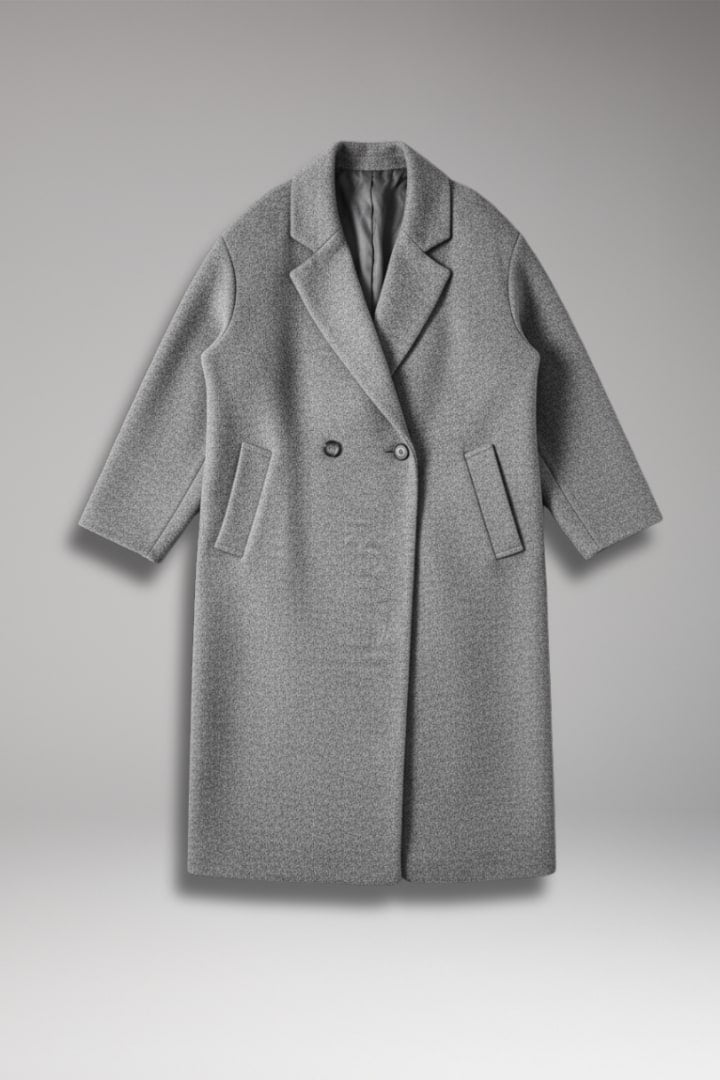 Front view of a grey double-breasted long coat laid flat on a grey background.