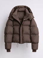 Front view of a brown hooded cropped puffer jacket, laid flat on a white background.