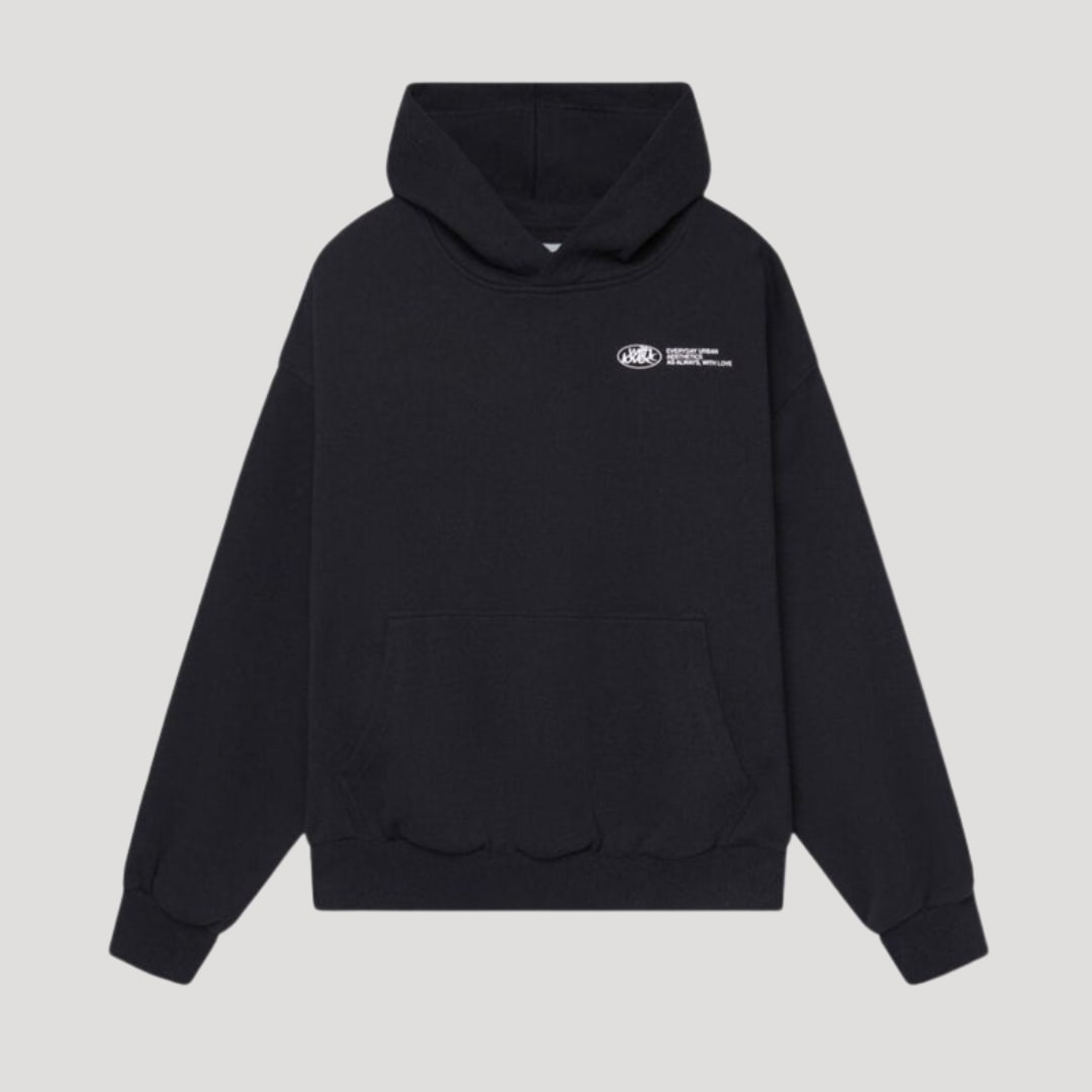 Front view of a black oversized pullover hoodie with a white graphic print on the chest.