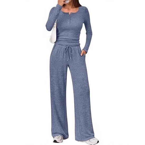 Front view of a woman wearing a blue ribbed long sleeve henley top and matching wide-leg lounge pants.