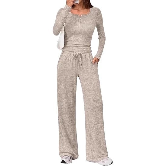 Front view of a woman wearing a light brown ribbed long sleeve henley top and matching wide-leg lounge pants.