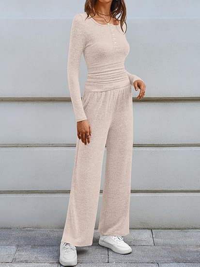 Front view of a woman wearing a light beige long-sleeve top and wide-leg pants set.