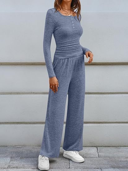 Front view of a woman wearing a blue-grey long-sleeve top and wide-leg pants set.